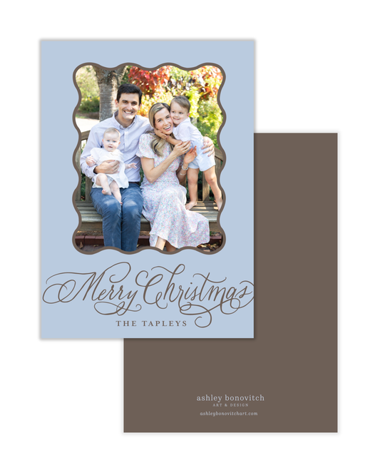 Simple Wavy Calligraphy Christmas Card in Light Blue With Brown Writing